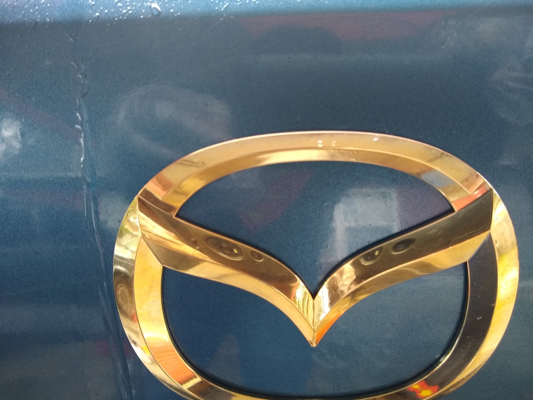 ChromeKarats gold plating work — Gold Mazda 3 Trunk Badge — Close-Up